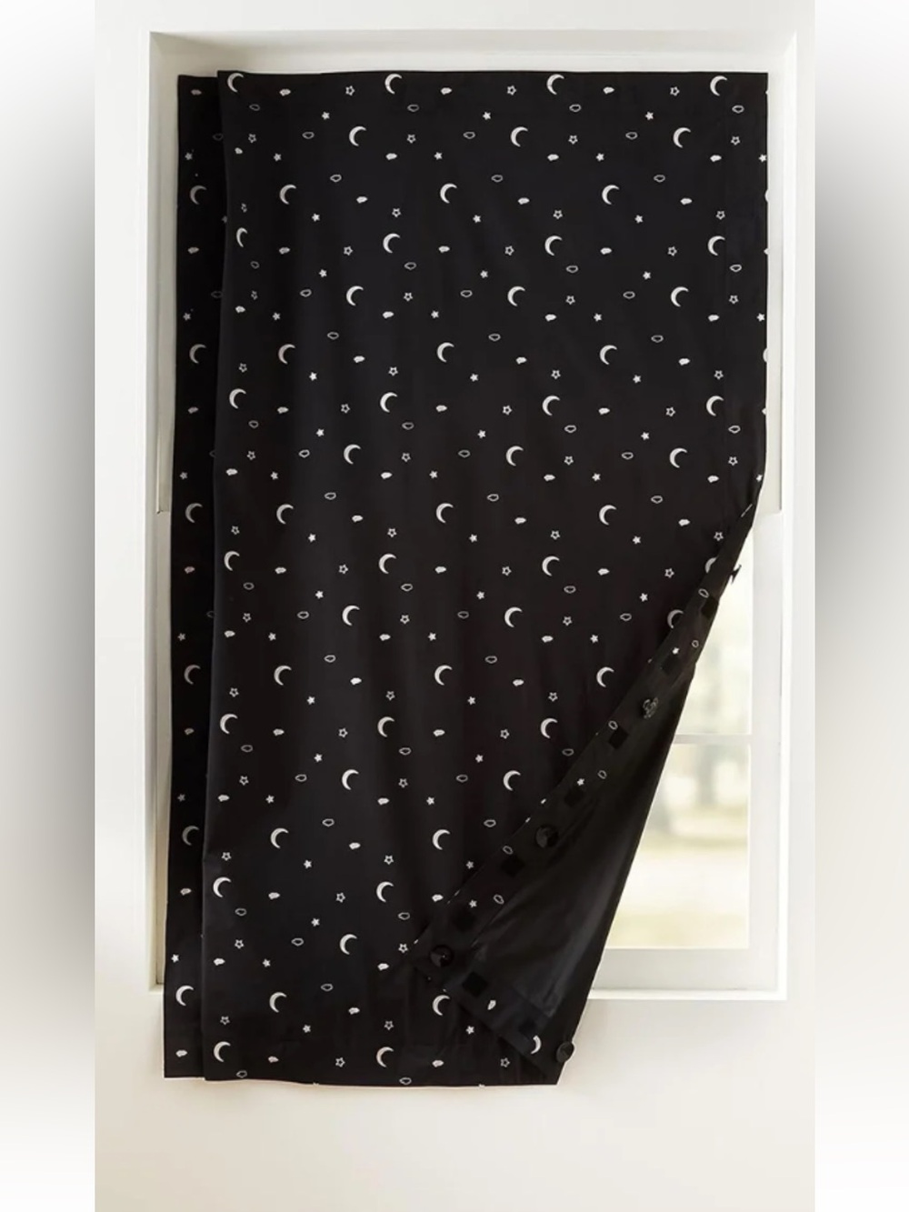 Black out travel curtain with suction cups and Velcro adjustable window size.